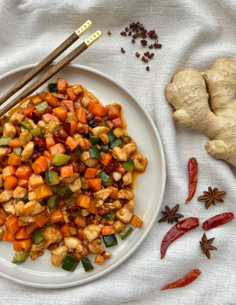 Delicious stir-fry with chicken, vegetables, ginger, and spices, perfect for a spicy meal.
